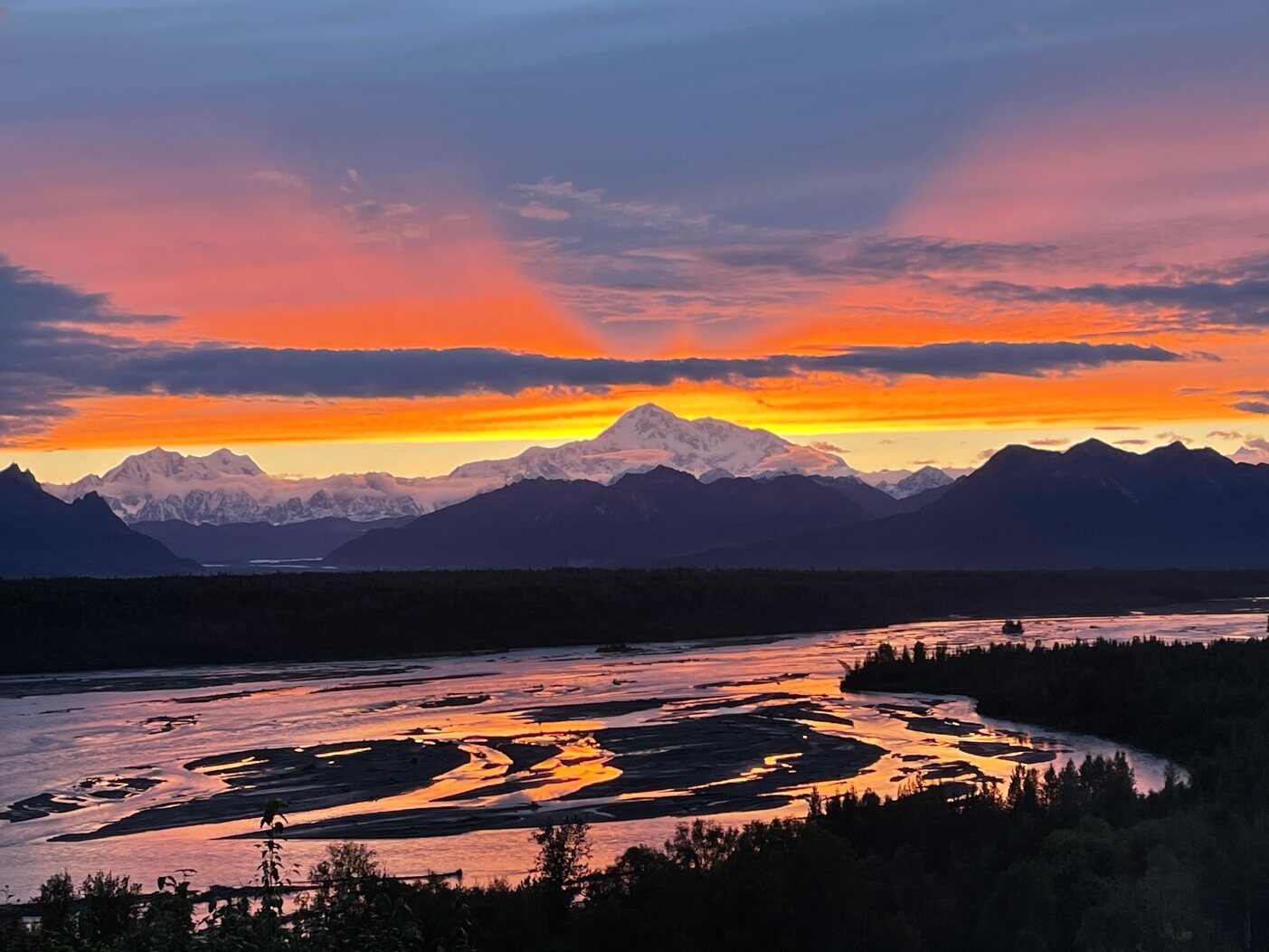 Mt. Denali and the braided Chulitna River at an 11:30 PM summer sunset